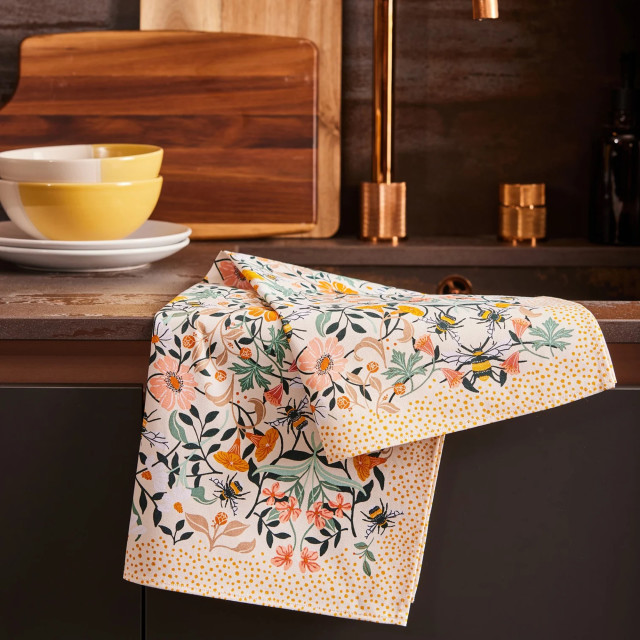 Ulster Weavers Cotton Bee Bloom Tea Towel on the table