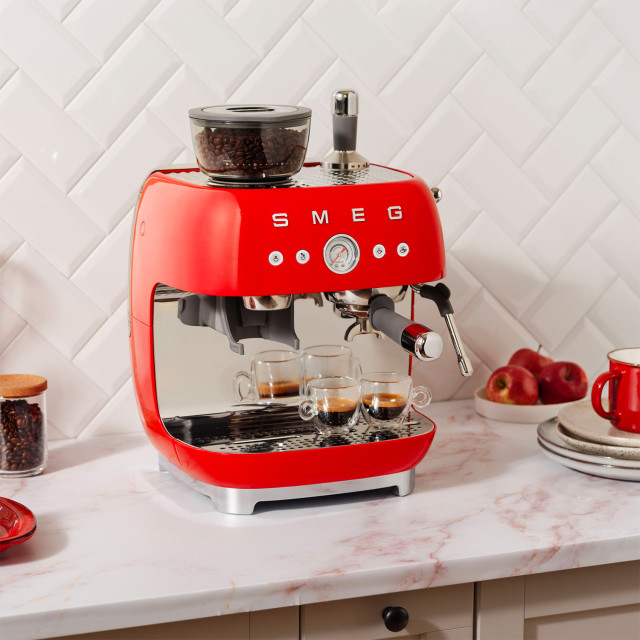Smeg Retro Manual Espresso Coffee Machine with Grinder - Red on the kitchen counter