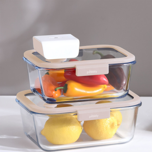 Pebbly Rechargeable Electronic Vacuum Pump on a container