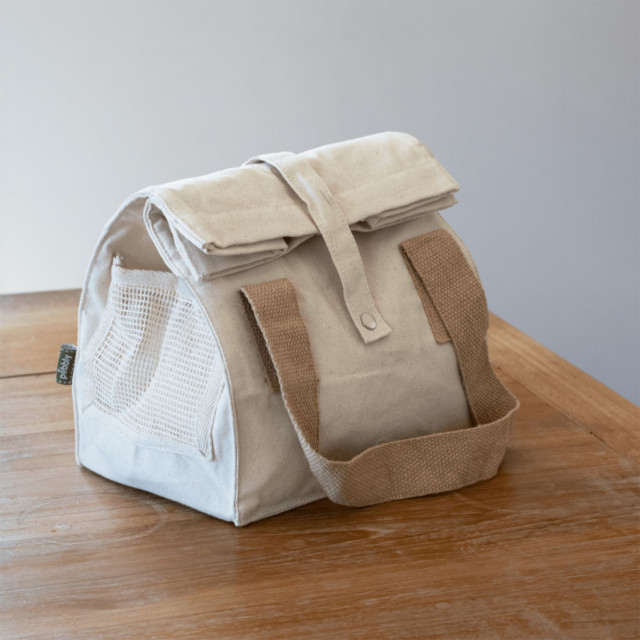 Pebbly Cotton Lunch Bag - Cream on the table