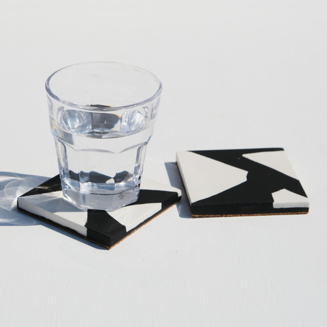 Alkaline Chunky Terrazzo Square Coasters, Set of 2 - Black and White with a glass of water