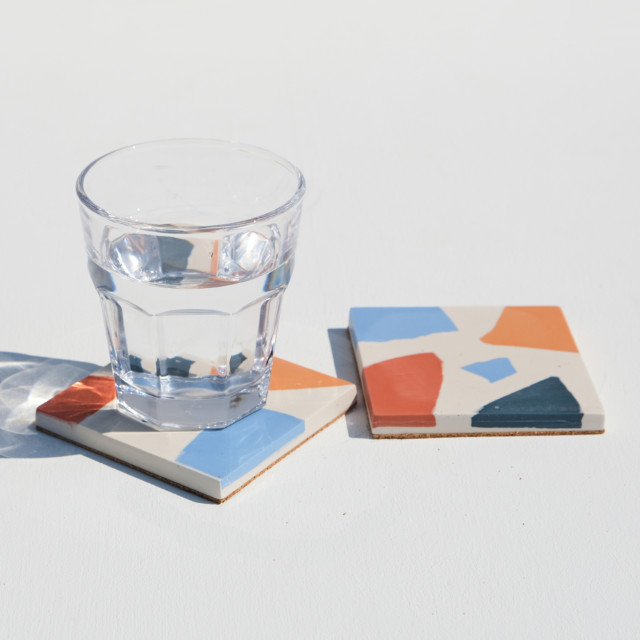 Alkaline Chunky Terrazzo Square Coasters, Set of 2 - Neutral detail with a glass of water