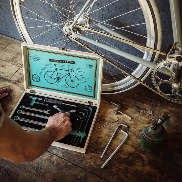 Gentlemens Hardware Cyclist's Tool Kit next to a bicycle