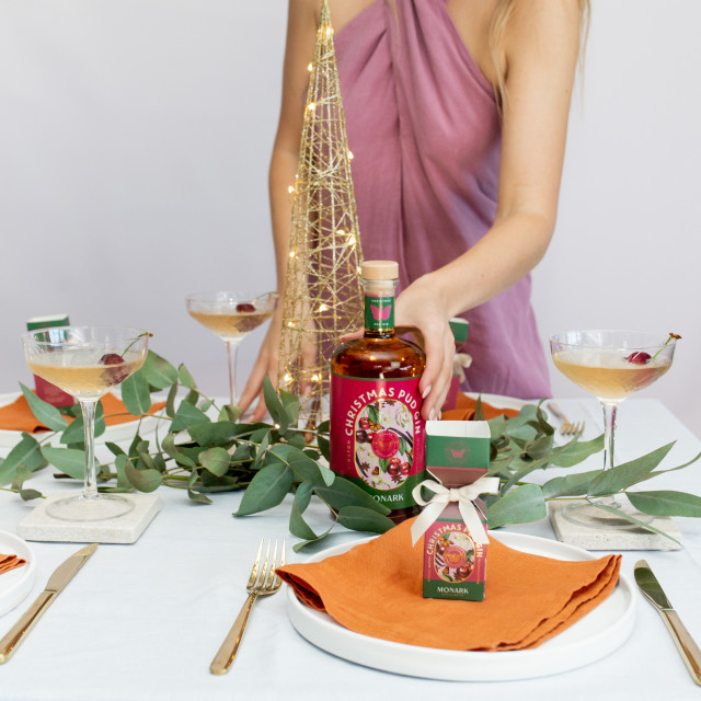 Monark Distillery Christmas Pud Gin - 750ml on a dinner table