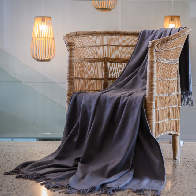 Aranda Iron Melody Throw, 150cm x 200cm on a chair
