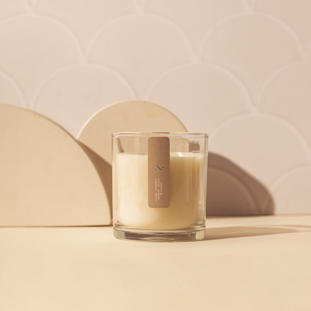 Nude Home Fragrances Chasing Sunsets Wood Wick Candle, 300ml on counter with decor