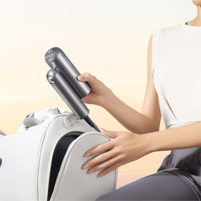 Dreame All-In-One Portable High-Speed Hair Dryer, 1000W - Grey being packed into backpack