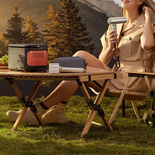 Dreame All-In-One Portable High-Speed Hair Dryer, 1000W - Grey being used at a camp