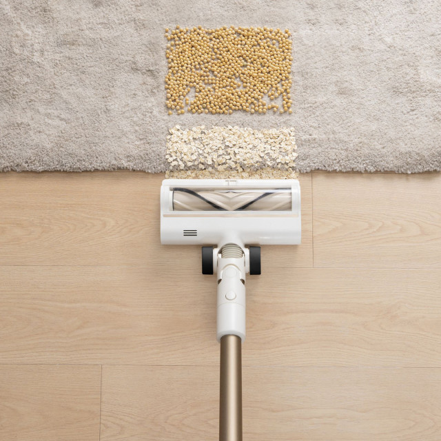 Dreame R10 Cordless Stick Vacuum Cleaner, 350W - Rose Gold close up of cleaning up dirt