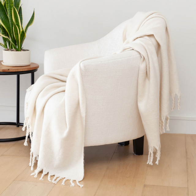 Linen House Pearl Embrace Throw on a chair