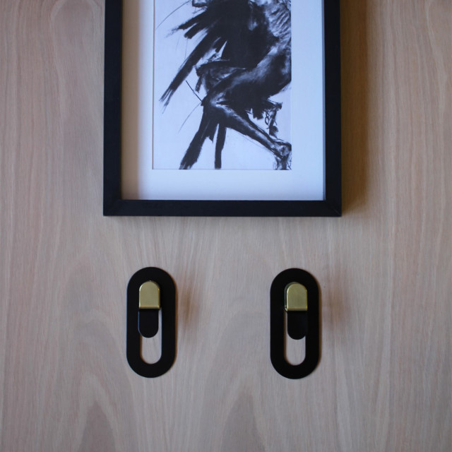 Joon Single Coda Hook with Brass Accent on a wall