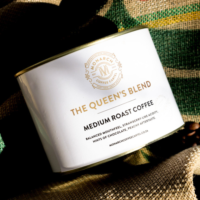 Monarch Coffee Cartel Queen's Blend Coffee Beans, 250g - Paint Tin on a cloth