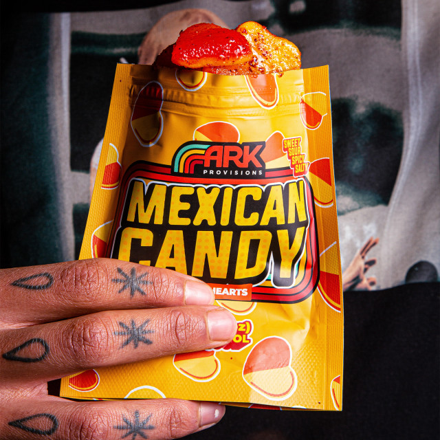 ARK Provisions Peach Hearts Mexican Candy, 100g showing scale in hand
