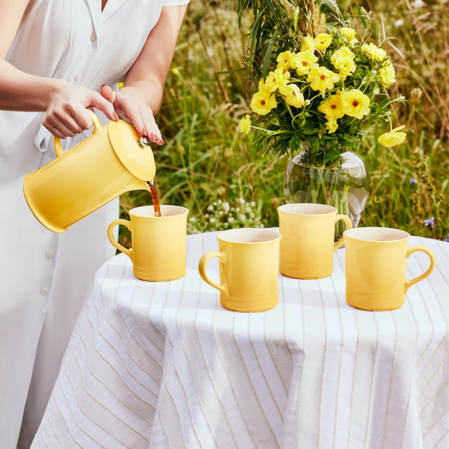 Le Creuset Chamomile Coffee Press, 1L on the table with mugs