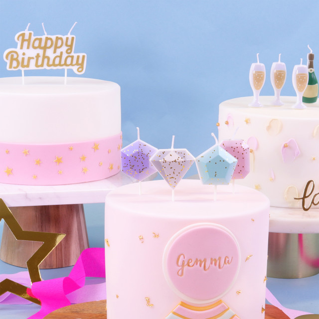 PME Happy Birthday Candle - Gold on a cake