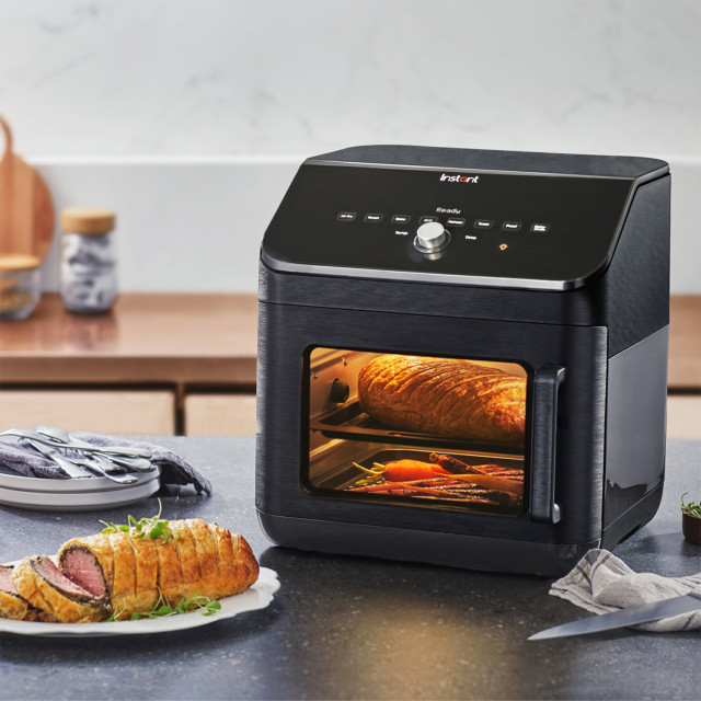 Instant Vortex Plus Airfryer Oven with Clearcook Window, 13L on the kitchen counter with food