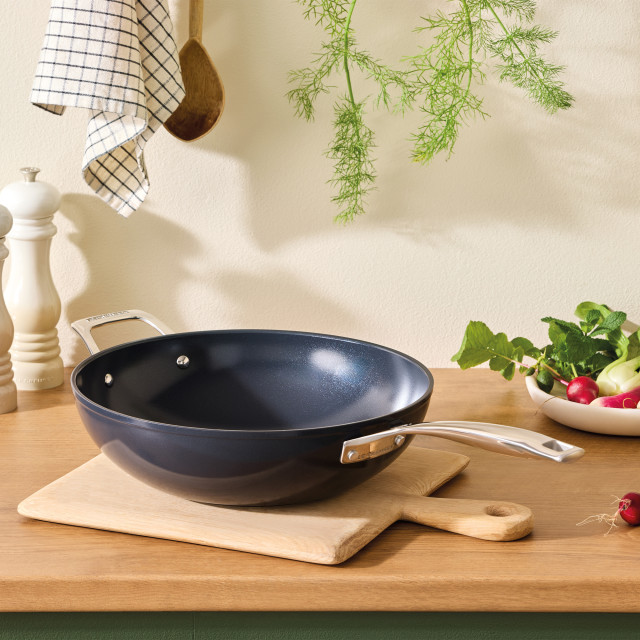 Le Creuset Essential Non-Stick Ceramic Stirfry Pan with Helper Handle, 30cm on the kitchen counter