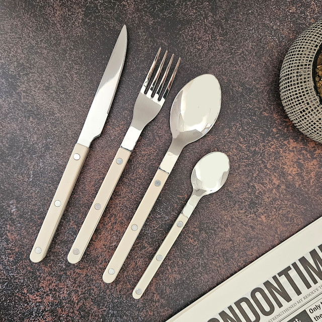 Nicolson Russell Louisiana Cutlery Set, 16-Piece - Ivory on the table