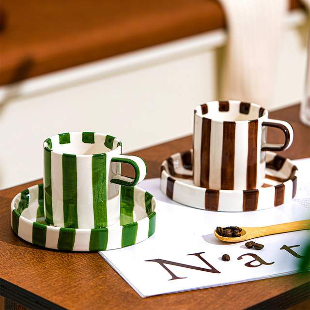 Nicolson Russell Chelsea Striped Cup & Plate, Set of 2 - Green on the table with a brown set