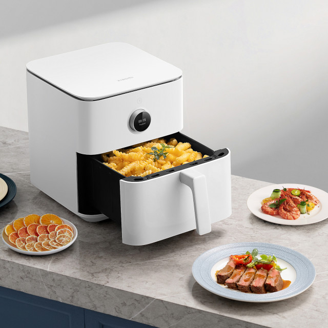 Xiaomi Smart Air Fryer, 6.5L with food on the table