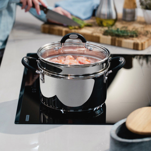 Tramontina Solar Stainless Steel Steamer Set, 2-Piece on the stove