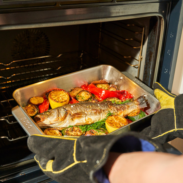 Ooni Roasting Pan - Large with food in an oven