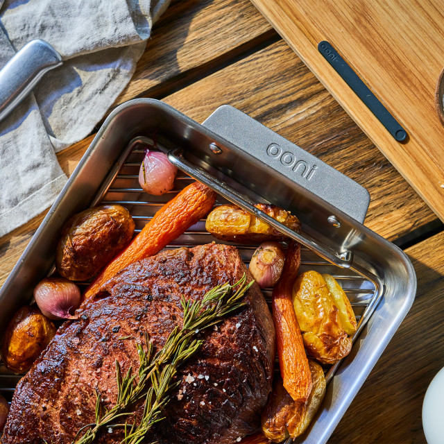 Ooni Roasting Pan - Large with food on the table