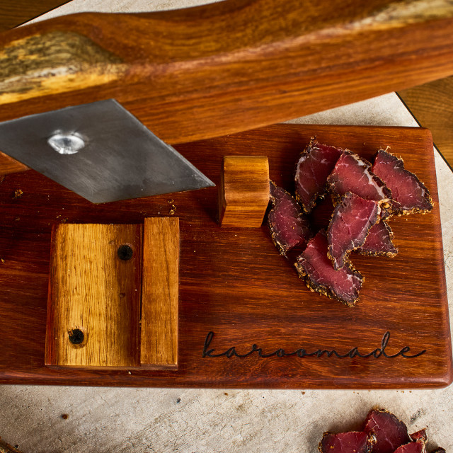 Biltong cutter on table with biltong close up