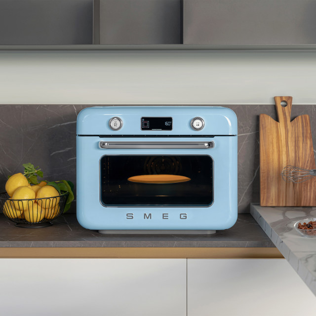Smeg Retro Countertop Steam Oven - Pastel Blue on the kitchen counter