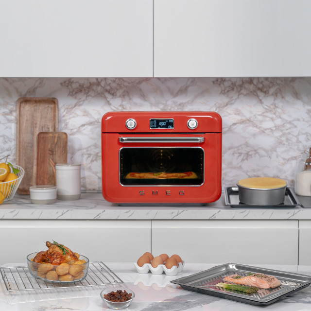 Smeg Retro Countertop Steam Oven - Fiery Red on the kitchen counter