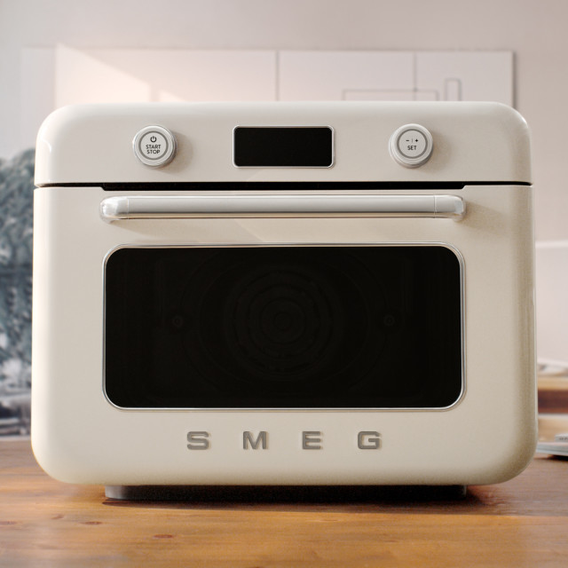 Smeg Retro Countertop Steam Oven - Vintage Cream on the kitchen counter
