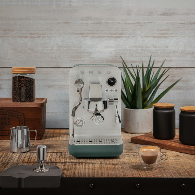 Smeg Minipro Espresso Machine - Matte Emerald Green with a cup of espresso