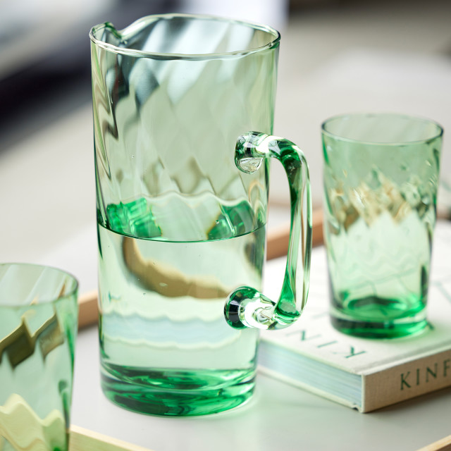 Lyngby Glas Green Vienna Jug, 1.9L on the table with water