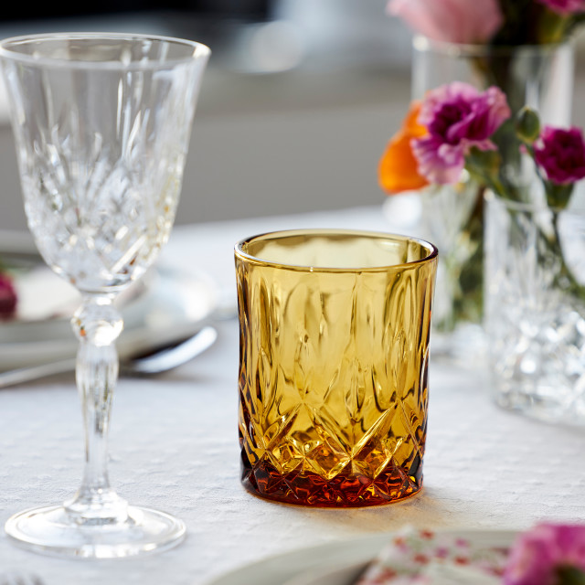 Lyngby Sorrento Whisky Glasses, Set of 4 - Amber on the table