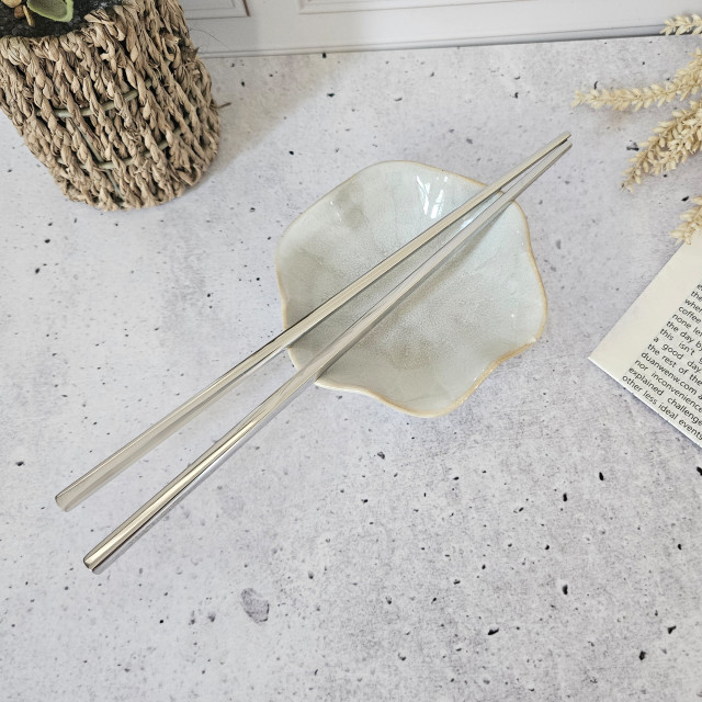 Nicolson Russell Stainless Steel Chopsticks, Set of 2 - Mirror on the table