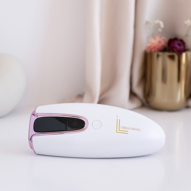 Lumilia Lux 2-in-1 IPL Laser Hair Removal & Skin Rejuvenation Handset - White Pearl on the table