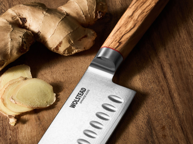 Wolstead Satoru Damascus Santoku Knife - 14cm on the table