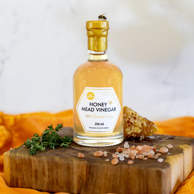 Cape Town Meadery Honey Mead Vinegar, 250ml on a wooden board