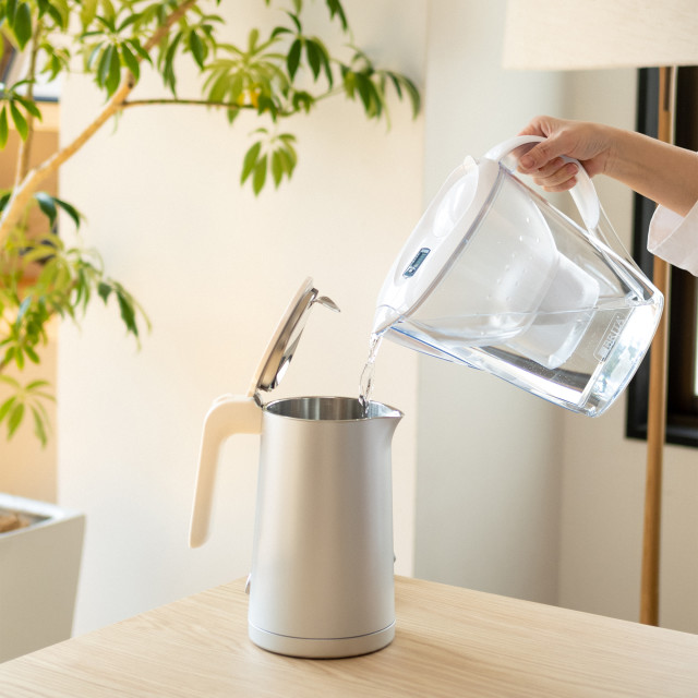 Brita Marella White Water Filter Jug with 3 Filters, 2.4L pouring water into kettle
