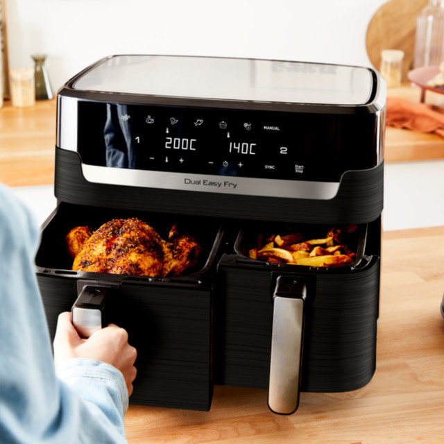 Tefal Easy Fry Dual Airfryer, 8.3L with food on. the table