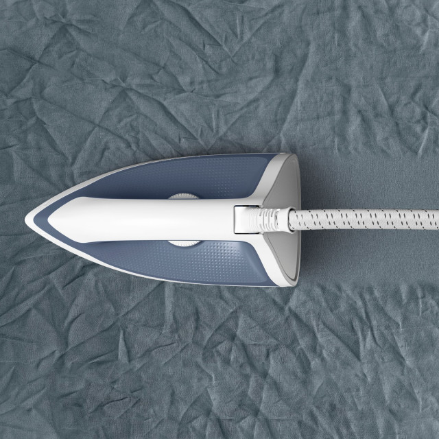 Tefal Express Optimal Steam Generator Iron, 2200W on a linen sheet
