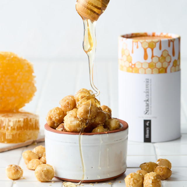 Snackadamia Gourmet Roasted Honey Flavoured Macadamia Nuts - 250g on the counter