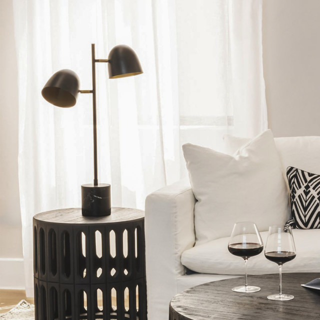 Hertex HAUS Serenity Bedside Lamp - Tarnished on a side table