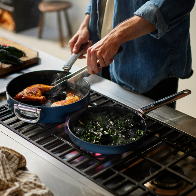Joseph Joseph Space Ceramic Non-Stick Frying Pan with Folding Handle - 24cm on the stove