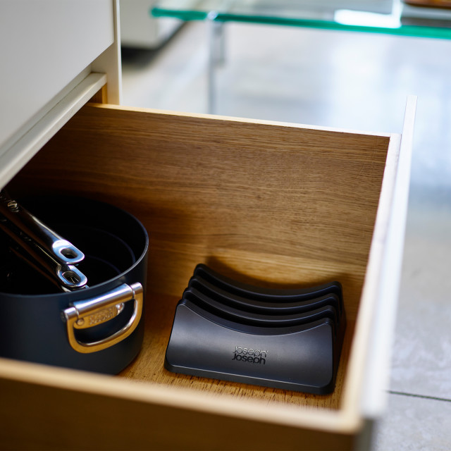 Joseph Joseph Space Lid Storage Stand in the drawer with lids