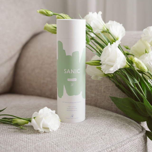 Sanic Mattress & Upholstery Floral Fresh Powder, 400g on the couch