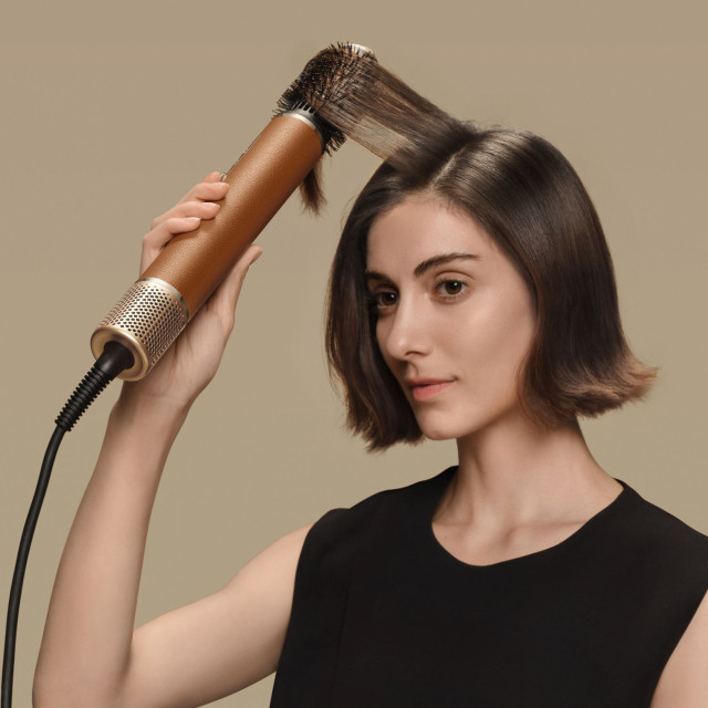 Dreame Airstyle Pro 7-in-1 Hair Drying & Styling Tool Kit combing hair