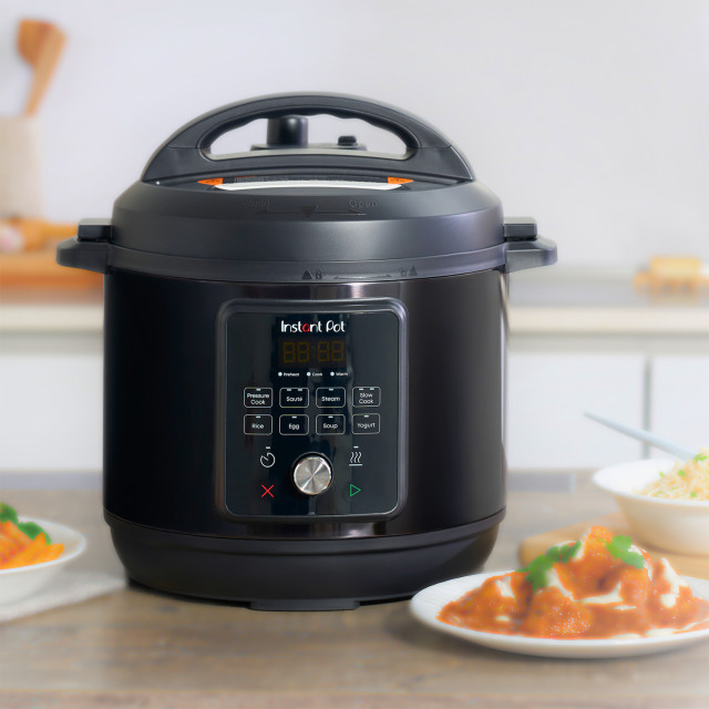 Instant Easy Pot Duo 8-in-1 Smart Cooker, 6L on the table with food