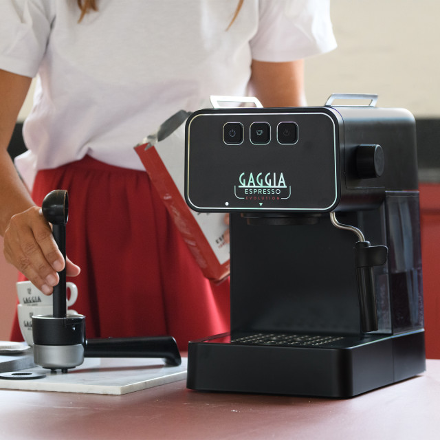 Gaggia Evolution Espresso Coffee Machine - Black on the kitchen counter with a Portafilter