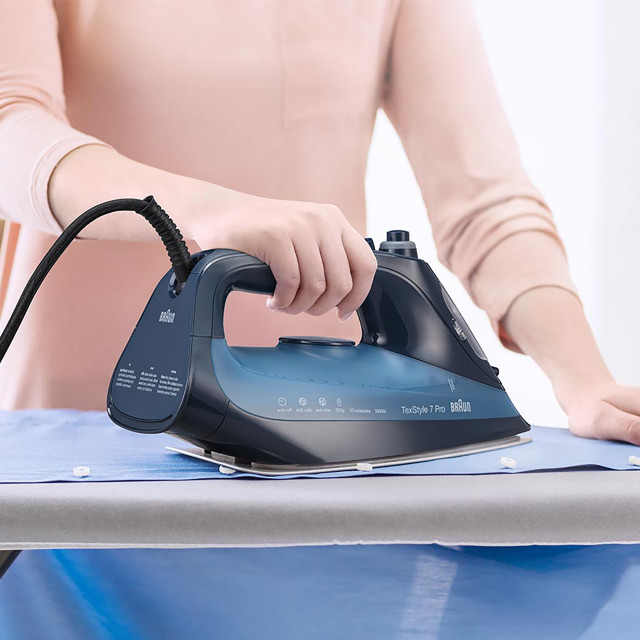 Braun TexStyle 7 Steam Iron, 3000W ironing a shirt